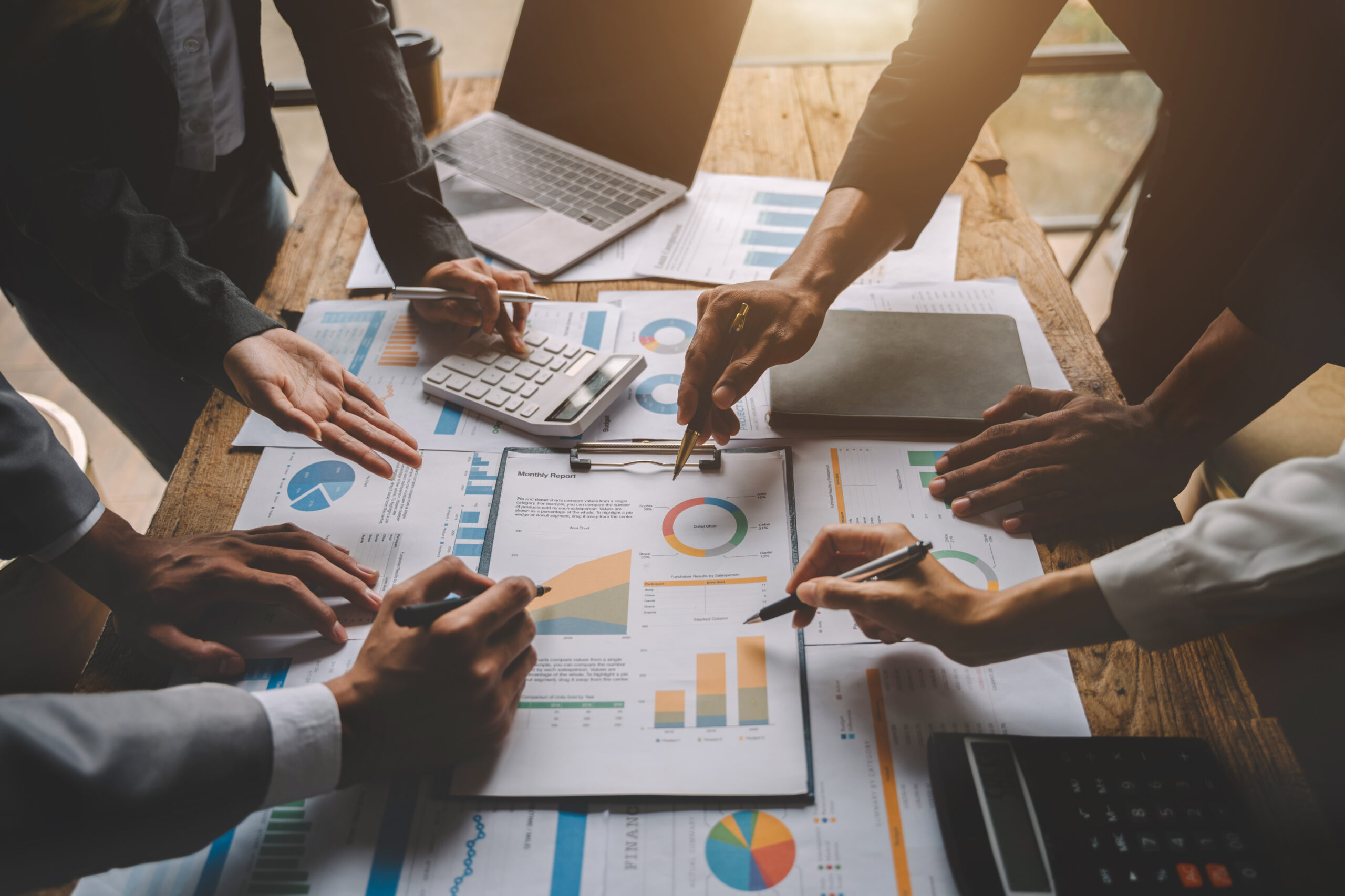usiness team meeting present.professional investor working with usiness team meeting present.professional investor working with new startup project. Finance managers task.Digital tablet laptop computer design smart phone in morning light.